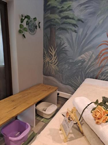 a room with a table and a bed with a desk at Shangrila-innibos Country Lodge in Hartbeespoort