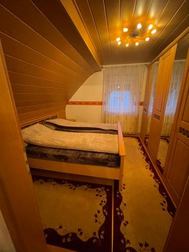 a small room with a bed in a tunnel at Ferienwohnung Anna in Hoppstädten-Weiersbach