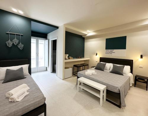 Postel nebo postele na pokoji v ubytování D'Aleammare - Rooms