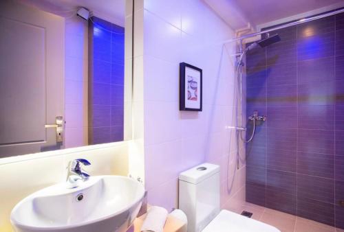 a bathroom with a sink and a toilet and a shower at Stylish Boutique Loft With Private Balcony in Athens