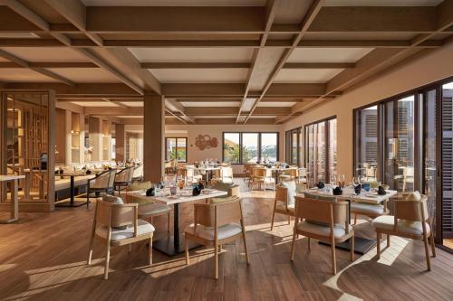 a rendering of a restaurant with tables and chairs at BAY RESORT HOI AN in Hoi An