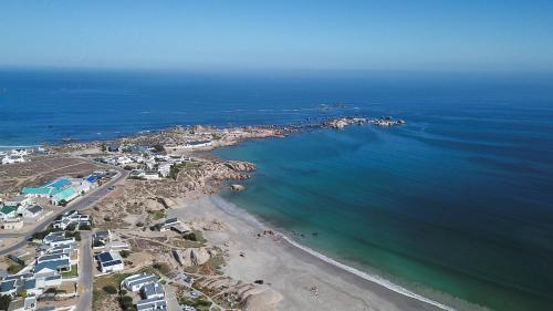 an aerial view of a beach and the ocean at Flamink Beach View Cottage in Paternoster in Paternoster