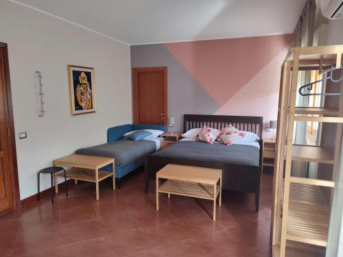 A bed or beds in a room at B&B CasaBuddace