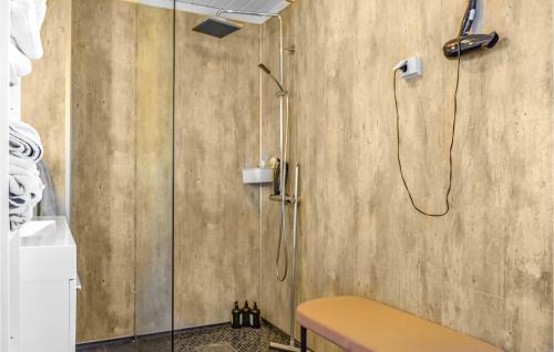 a shower in a bathroom with a glass shower stall at Beautiful Home In Frresfjorden With 4 Bedrooms, Sauna And Wifi in Sørvåg