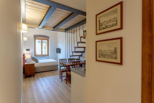 a living room with a kitchen and a dining room at Ramaglianti Apartments Suite Tre in Florence