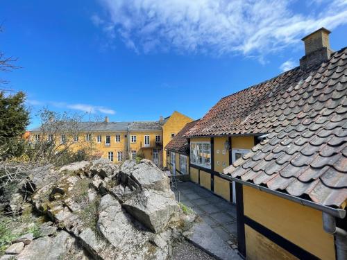 a view from the courtyard of a building at JANTZENs HOTEL in Gudhjem