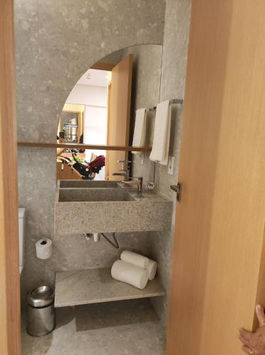 a bathroom with a sink and a mirror at Salinas Premium Resort in Salinópolis