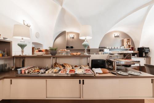 a buffet with many different types of food on a table at Penzion Austis in Znojmo