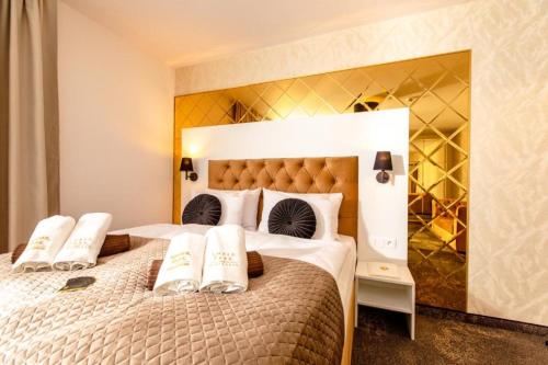 Ένα ή περισσότερα κρεβάτια σε δωμάτιο στο Amber Park Spa