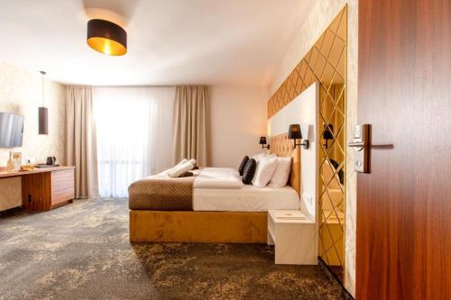 Ένα ή περισσότερα κρεβάτια σε δωμάτιο στο Amber Park Spa