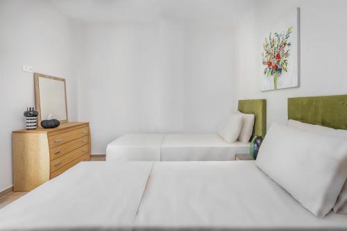 Ένα ή περισσότερα κρεβάτια σε δωμάτιο στο Epta Villas Luxury Redefined