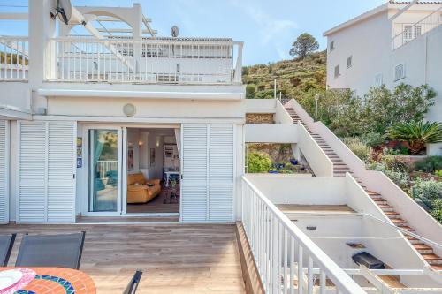 a home with a staircase leading up to a house at Mimoses B 2 Canyelles Roses - Immo Barneda in Montjoys
