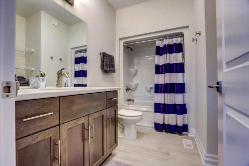 a bathroom with a sink and a toilet and a shower at GLOBALSTAY New houses near Huron Lake in Port Elgin