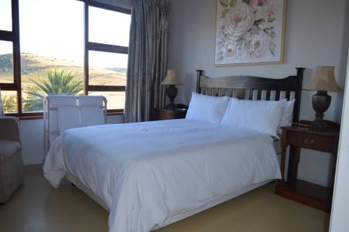Giường trong phòng chung tại De Buysvlei Guesthouse near Addo Elephant Park
