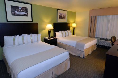 a hotel room with two beds and a window at Holiday Inn - Fort Myers - Downtown Area by IHG in Fort Myers