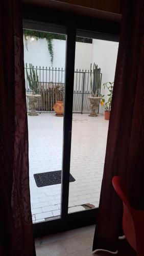 a view from a window of a patio with a gate at Tejo Apartment in Lisbon