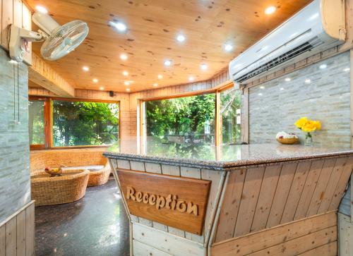 a kitchen with a bar in a house at Hotel Mirage in Srinagar