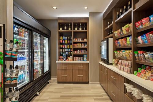 a grocery store aisle with a grocery store soda aisle at SpringHill Suites by Marriott West Sacramento in West Sacramento