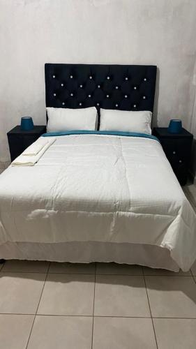 Postel nebo postele na pokoji v ubytování Pfumbada Guesthouse