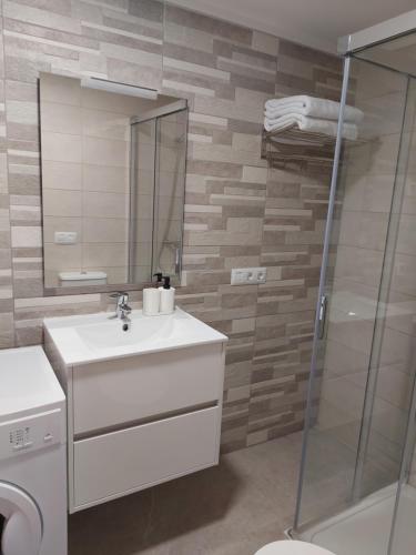 a bathroom with a sink and a shower at ESTUDIO LA ESTRELLA in Candelaria