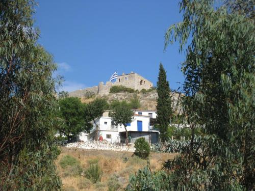 a house on a hill with a castle on top at Castle View Studios in Paralion astros