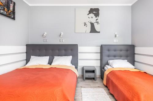 Postel nebo postele na pokoji v ubytování Aqua Viva Darłowo Apartment by Noclegi Renters