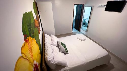 Postel nebo postele na pokoji v ubytování Pousada Praia e Conforto