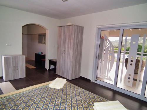 a living room with a large sliding glass door at Don Genaro Apartments in Barber