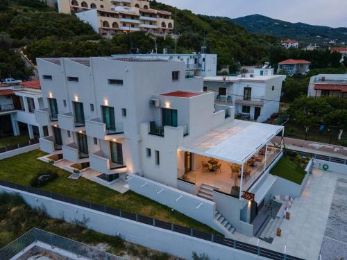 an aerial view of a large white house at Niso Skiathos in Skiathos Town