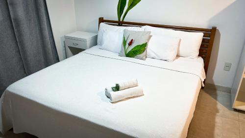 Postel nebo postele na pokoji v ubytování Pousada Praia e Conforto