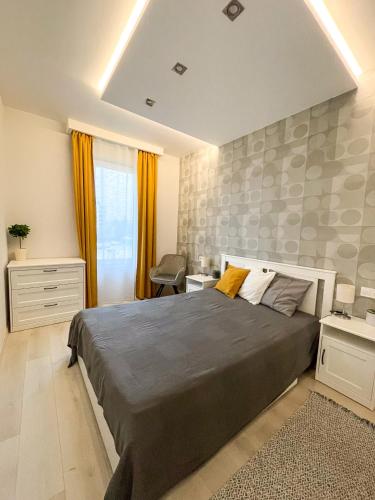 a bedroom with a large bed in a room at MyFlat Viewpoint 57 in Siófok