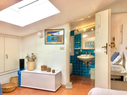 a bathroom with a sink and a toilet at Marinella Sky View in Marinella