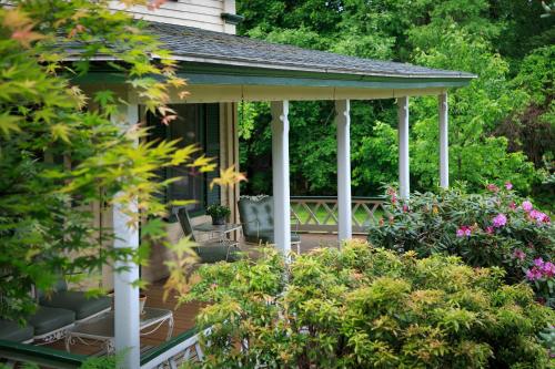 a gazebo on the side of a house at Squam Lake Inn in Holderness