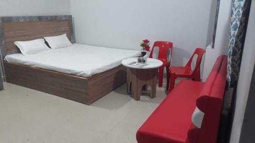 מיטה או מיטות בחדר ב-OYO River View Resort