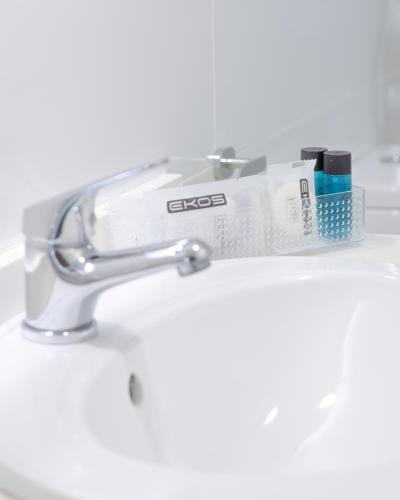 a close up of a sink with a toothbrush at Apartamentos Maspalomas Foresta in Maspalomas