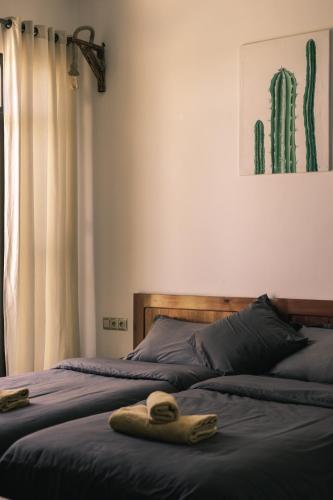 a bedroom with two beds with towels on them at The Kozyhome in Ouarzazate