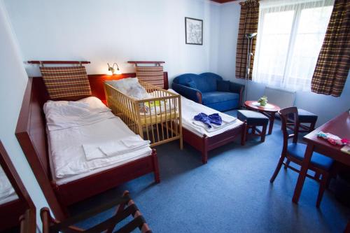 Postel nebo postele na pokoji v ubytování Hotel GOLFER