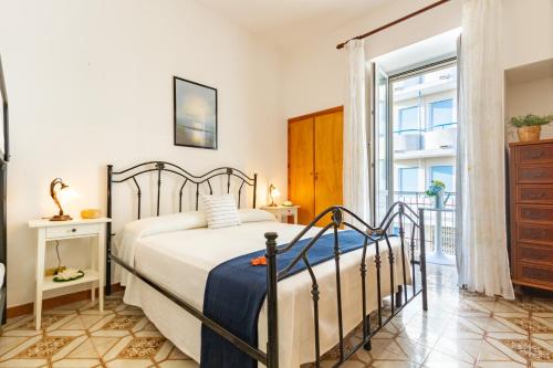 Ένα ή περισσότερα κρεβάτια σε δωμάτιο στο Appartamento Limonaia Bilo - MyHo Casa