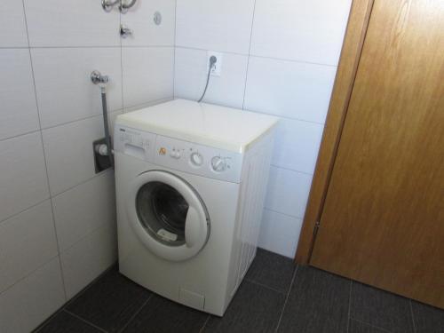 a washer and dryer in a small room at Apartment MiaAntonia in Vrsi