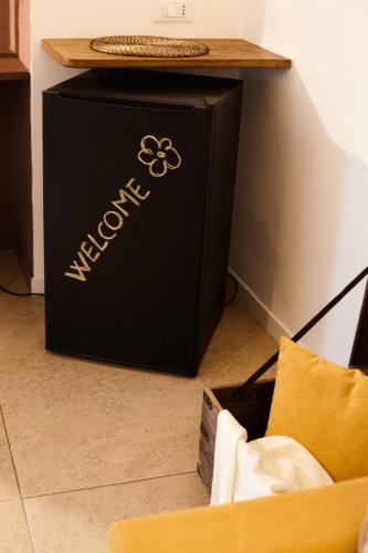 a black box sitting on the floor next to a table at Casetta Zio Franco in Polignano a Mare