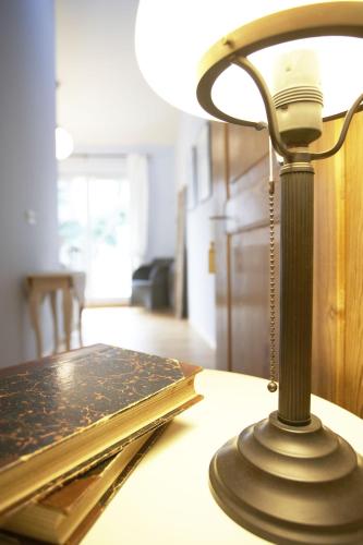 a lamp sitting on top of a table at Alte Remise in Dresden