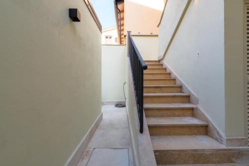 a staircase in an empty building with a stair railing at Apartments Urban in Poreč
