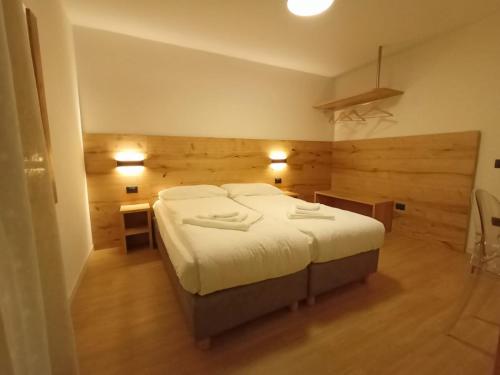 Postel nebo postele na pokoji v ubytování Appartamento Campanile Basso