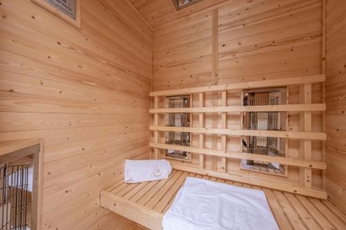 a wooden room with a bed in a sauna at The Old Chapel in Pentney