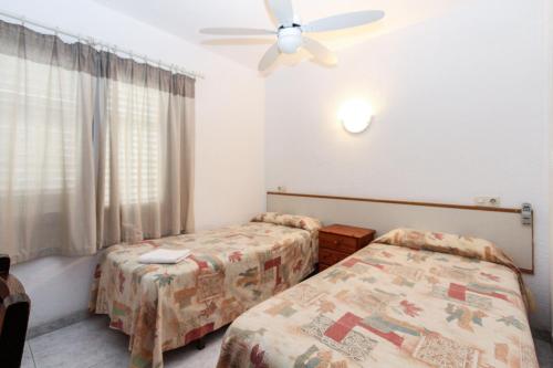 Posteľ alebo postele v izbe v ubytovaní Apartment Bond