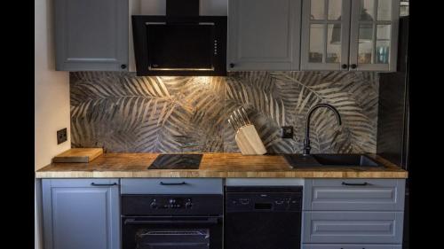 Kuchyň nebo kuchyňský kout v ubytování MARCEL APARTMENT