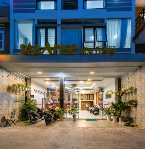 a store with motorcycles parked inside of a building at Arise Seaside Hotel in Nha Trang