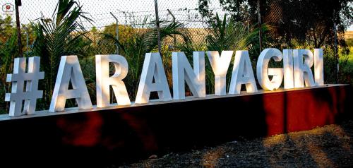 a large sign that says the maranazi at Aranyagiri Countryside Resort, Near Pune in Pune
