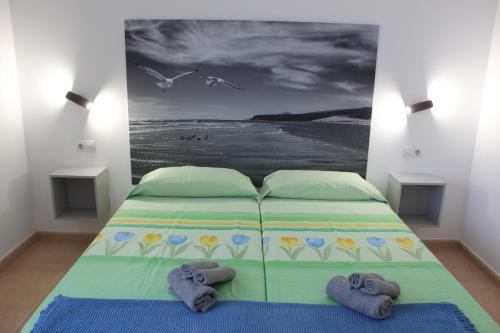 Postel nebo postele na pokoji v ubytování Casa Gaia a 5 minutos de la playa de las dunas