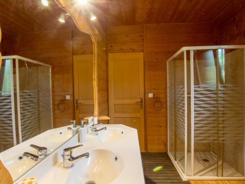 a bathroom with two sinks and a glass shower at Charmante maison avec piscine privée, climatisation, WiFi et parking - FR-1-616-166 in Montagnac-dʼAuberoche